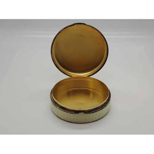 100D - Continental 925 silver circular box, guilloche enamelled throughout, the hinged cover with white ros... 