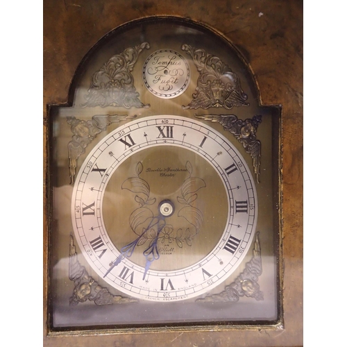 350A - Elliott burr walnut cased table clock for Boodle & Dunthorne, not working at lotting, H: 27 cm. UK P... 