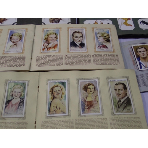 404A - Mixed cigarette cards in albums. UK P&P Group 2 (£20+VAT for the first lot and £4+VAT for subsequent... 