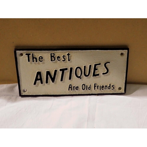 1052 - Cast iron The Best Antiques Are Old Friends sign. W: 25 cm. UK P&P Group 1 (£16+VAT for the first lo... 