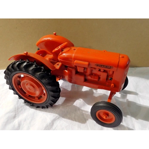 1176 - Boxed Pippin Toys plastic Nuffield tractor. UK P&P Group 1 (£16+VAT for the first lot and £2+VAT for... 