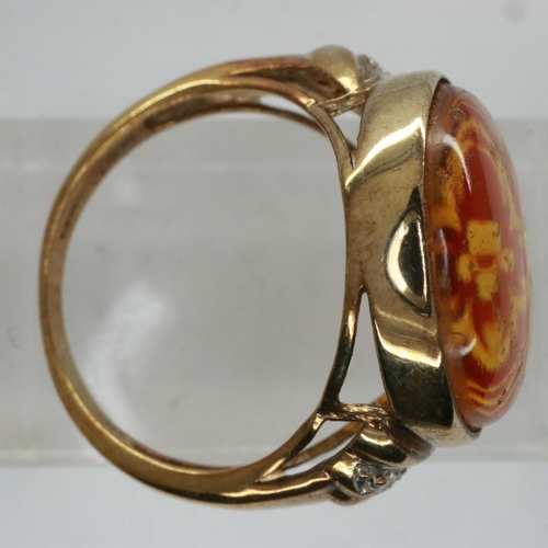 50 - 9ct gold ring set with carved amber and diamond shoulders, size Q, 4.2g. UK P&P Group 0 (£6+VAT for ... 