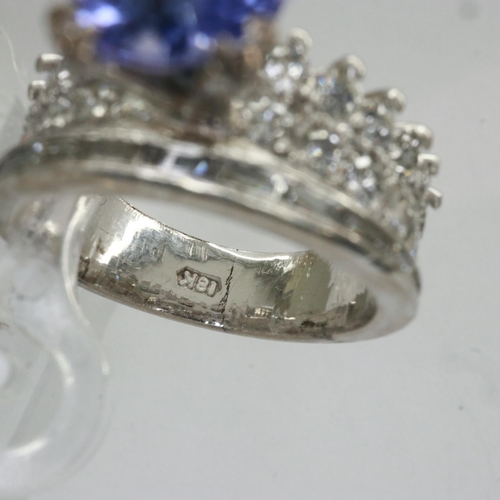 55 - 18ct white gold ring set with tanzanite and diamonds, size I/J, 5.1g, approximately 1.1 carat. UK P&... 