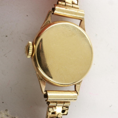 100 - OMEGA: 9ct gold cased ladies wristwatch on an expanding bracelet, 14.2g, working at lotting, damage ... 