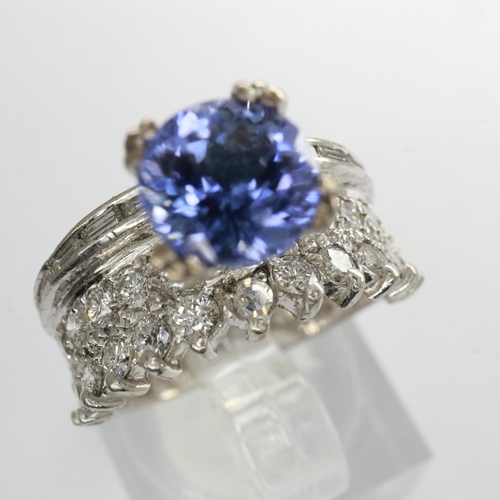 55 - 18ct white gold ring set with tanzanite and diamonds, size I/J, 5.1g, approximately 1.1 carat. UK P&... 