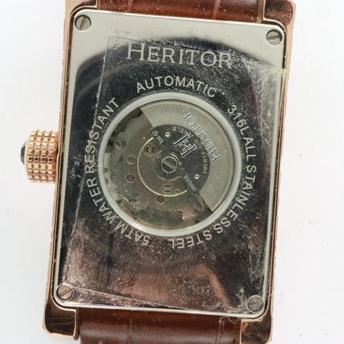 94 - HERITOR: gents automatic Jefferson wristwatch with etched steel rose gold case on a brown leather st... 