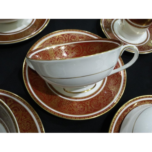 207 - Substantial Royal Doulton tea and dinnerware in the Buckingham pattern of fifty pieces, claret and g... 