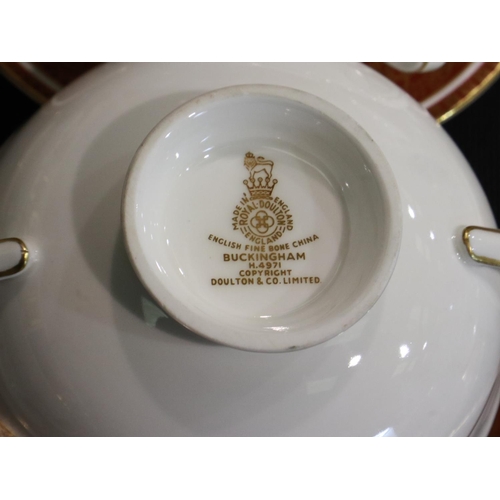 207 - Substantial Royal Doulton tea and dinnerware in the Buckingham pattern of fifty pieces, claret and g... 