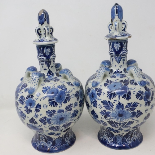 227 - Pair of Delft covered blue and white decanters, damage to lids, H: 26 cm. UK P&P Group 2 (£20+VAT fo... 