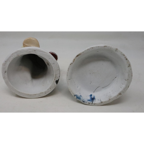 246 - Two Victorian ceramic spill holders in the form of a man and woman, signs of age and slight losses t... 