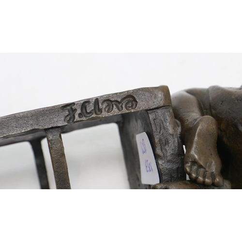 281 - Bronze sculpture of a child kneeling on a chair, signed J. Clara, H: 24 cm. UK P&P Group 2 (£20+VAT ... 