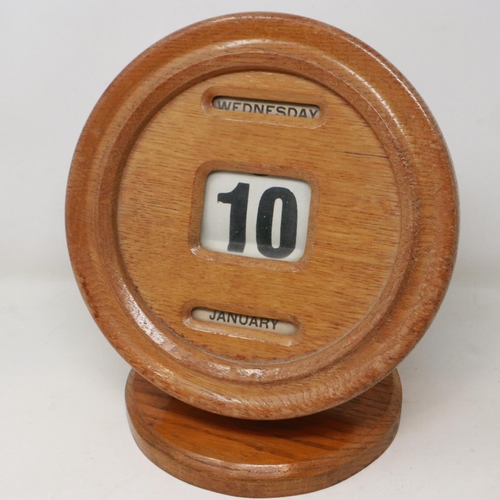 298 - Golden oak cased perpetual calendar with day, date and month, appears to be in working order, H: 27 ... 