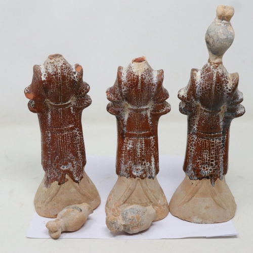 176 - Three Ming Dynasty tomb guardians, each holding a receptacle, damages to each neck, largest H: 27 cm... 