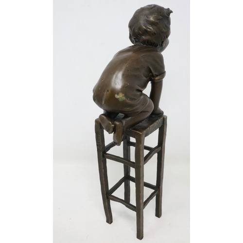 281 - Bronze sculpture of a child kneeling on a chair, signed J. Clara, H: 24 cm. UK P&P Group 2 (£20+VAT ... 