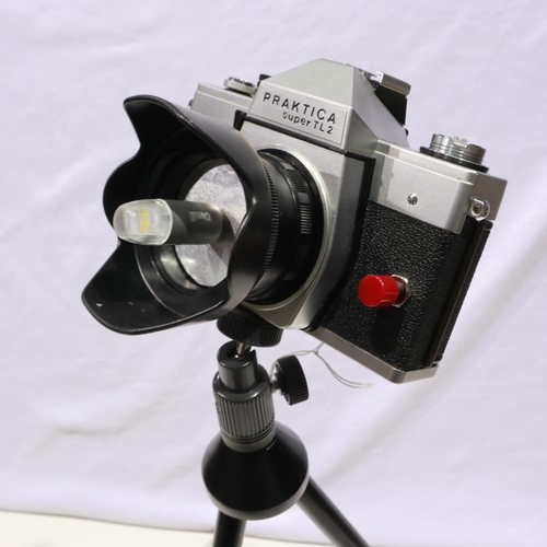 389 - LED camera lamp, made from a Praktica Super TL2 camera with power supply and tripod about 60cm tall,... 