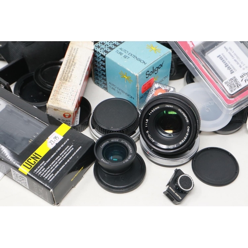 392 - Mixed camera lenses and camera accessories including Olympus and Canon. P&P Group 2 (£18+VAT for the... 