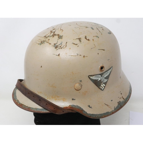 2082 - Third Reich Afrika Korps double-decal M35 helmet, stamped SE-64 (Sachwiwchw Emailler-und Stanzewerke... 