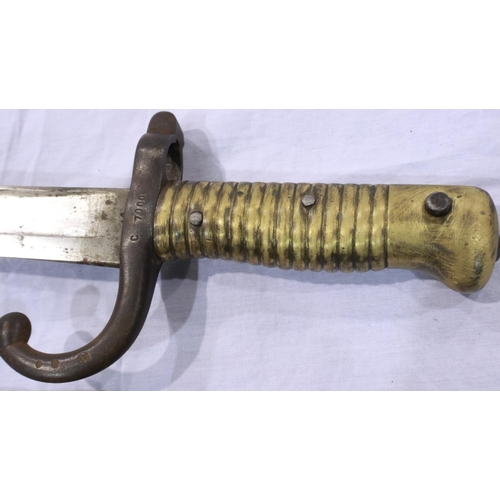 2144 - A French 19th century M1866 chassepot sword bayonet with hooked quillon and metal scabbard, dated 18... 