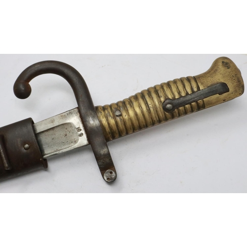 2144 - A French 19th century M1866 chassepot sword bayonet with hooked quillon and metal scabbard, dated 18... 