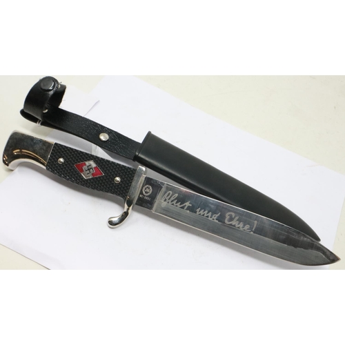 2148 - A replica Third Reich Hitler Youth dagger, with enamelled badge to the chequered grip and metal scab... 