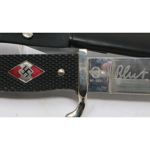 2148 - A replica Third Reich Hitler Youth dagger, with enamelled badge to the chequered grip and metal scab... 