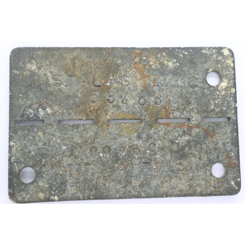 2194 - WWII German issued Prisoner of War dog tag from Stalag III C, a camp for Allied soldiers. near the v... 