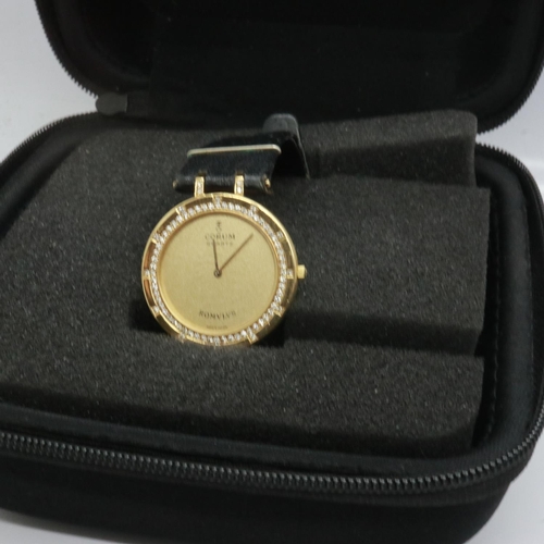 86 - CORUM ROMULUS: 18ct gold cased wristwatch with diamond set bezel on a black leather strap, not worki... 