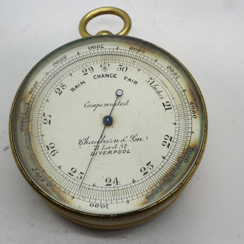 148 - Chadburn & Son Liverpool brass cased pocket aneroid barometer with integral compass and silvered dia... 