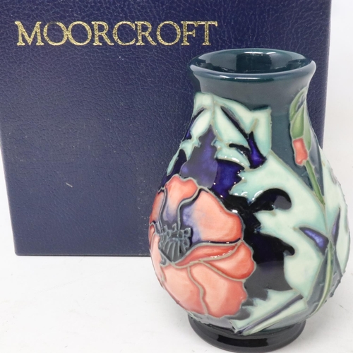 184 - Green ground Moorcroft diminutive vase in the Poppy pattern, no cracks or chips, H: 11 cm, boxed. UK... 