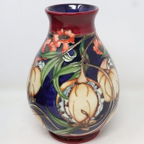 208 - Red ground Moorcroft vase in the Plevriana pattern, no cracks or chips, H: 20 cm, boxed. UK P&P Grou... 