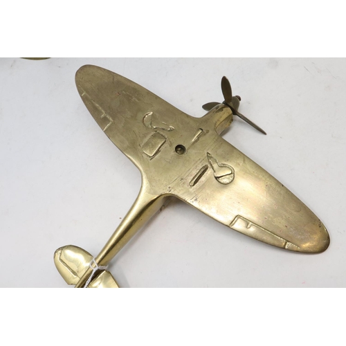 261 - Three brass fighter aeroplanes on brass stands, largest bears label for Bates Brass Birmingham, larg... 