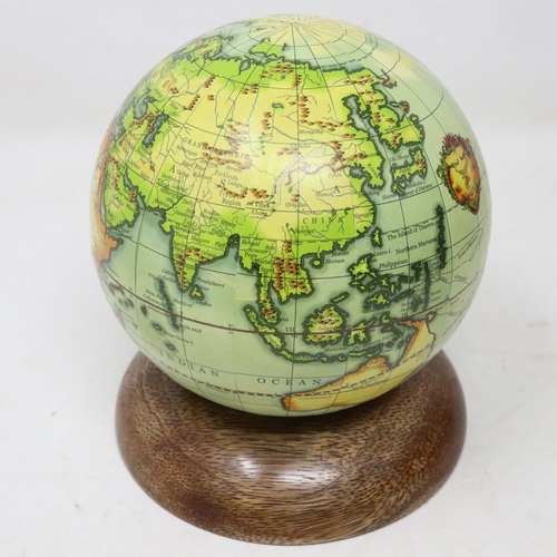 273 - Diminutive world globe on wooden base, H: 13 cm. UK P&P Group 1 (£16+VAT for the first lot and £2+VA... 