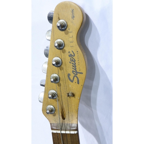 285 - Squier by Fender electric guitar, serial number YN764264, in poor condition. Not available for in-ho... 