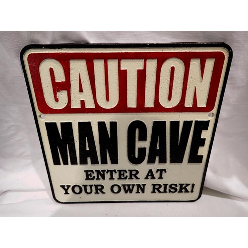 1303 - Cast iron Man Cave sign. W:25cm UK P&P Group 1 (£16+VAT for the first lot and £2+VAT for subsequent ... 