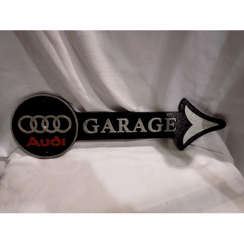 1398 - Cast iron Audi garage arrow. W:40cm. UK P&P Group 2 (£20+VAT for the first lot and £4+VAT for subseq... 