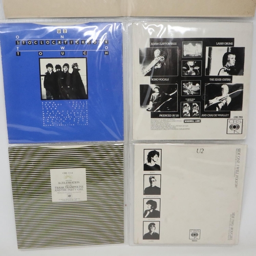 360 - U2 four picture sleeve singles in a plastic hanger, vinyl is black, labels are orange to yellow, no ... 