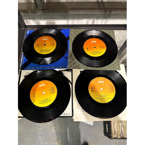 360 - U2 four picture sleeve singles in a plastic hanger, vinyl is black, labels are orange to yellow, no ... 