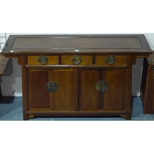 2062 - A 20th century hardwood sideboard in the Oriental manner, having three short drawers above two doubl... 