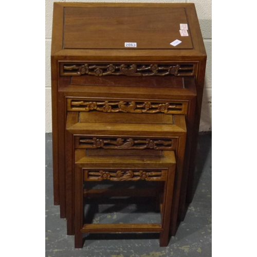 2063 - A 20th century nest of four Oriental hardwood graduating tables, largest 51 x 35 x 66 cm H.