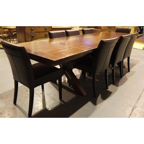 2064 - A substantial hardwood dining table, the extending top with two additional leaves raised on a cross-... 