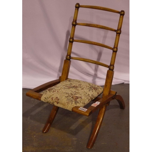 2069 - An Edwardian elm framed campaign chair, folding, with later upholstered seat, folding is secure, cus... 