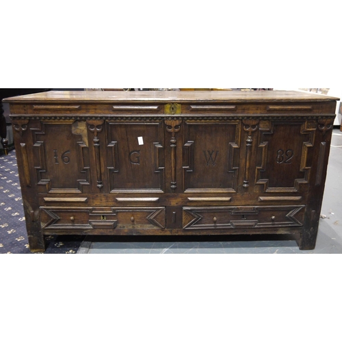 2073 - A 17th century English oak dower chest, the four panelled front initialled GW and dated 1682, with l... 