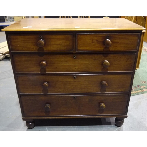 2081 - A Victorian walnut chest of two short above three graduated long drawers, raised on turned supports.... 