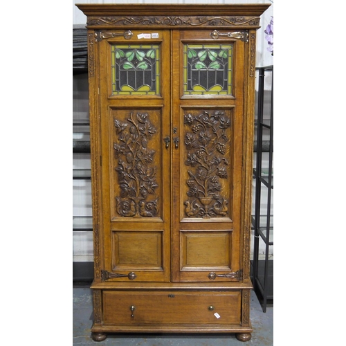 2093 - A rare Art-Nouveau period English oak two door wardrobe, in the manner of Gillows or Liberty. Each d... 