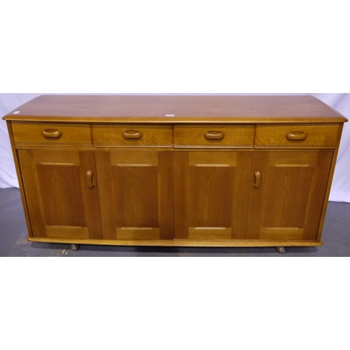 2101 - Priory of Manchester elm sideboard, of four drawers and two bi-fold cupboard doors, raised on castor... 