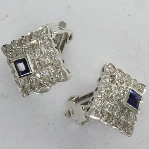 96 - Pair of 18ct white gold clip-on earrings, set with princess cut sapphires and diamonds, combined 7.3... 