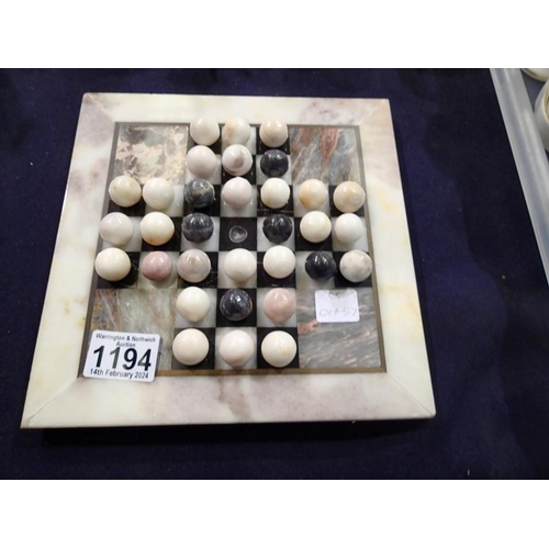 1194 - Polished marble solitaire board, (Complete) 22 x 22 cm. UK P&P Group 2 (£20+VAT for the first lot an... 