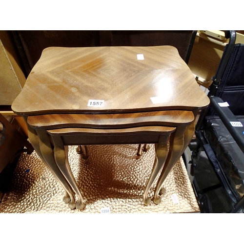 1557 - Walnut nest of three graduated tables with quartered veneer. Not available for in-house P&P