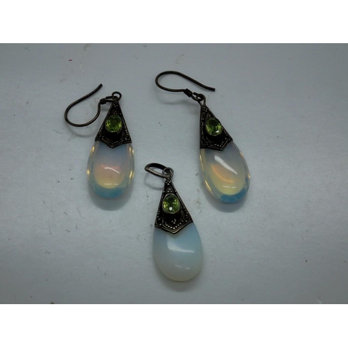 92 - 925 silver mounted moonstone pendant and a pair of earrings set with peridot. UK P&P Group 0 (£6+VAT... 