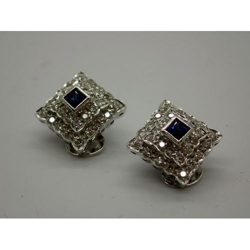 96 - Pair of 18ct white gold clip-on earrings, set with princess cut sapphires and diamonds, combined 7.3... 